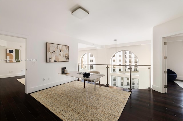 corridor featuring dark hardwood / wood-style floors