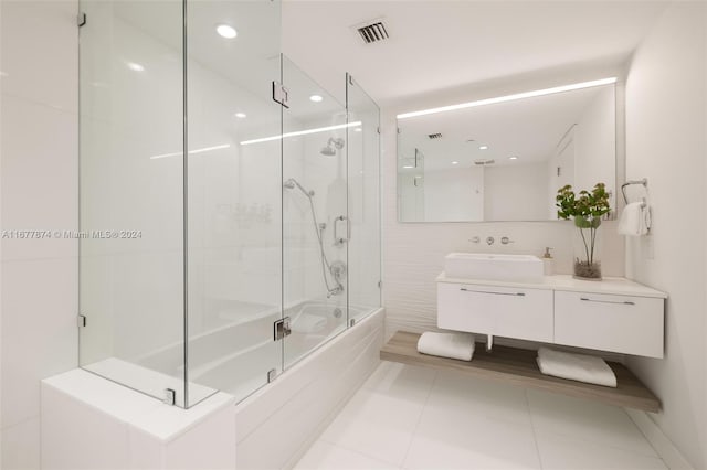 bathroom with shower / bath combination with glass door, vanity, and tile patterned floors