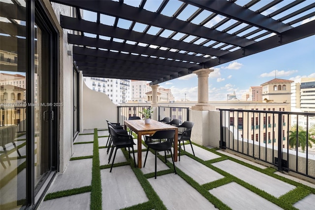 55 Merrick Way Unit 808, Coral Gables, FL 33134 - balcony with a pergola and outdoor dining area