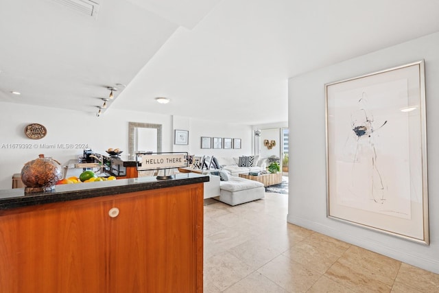 foyer entrance featuring track lighting