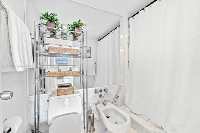 bathroom featuring toilet, walk in shower, a bidet, and tile walls