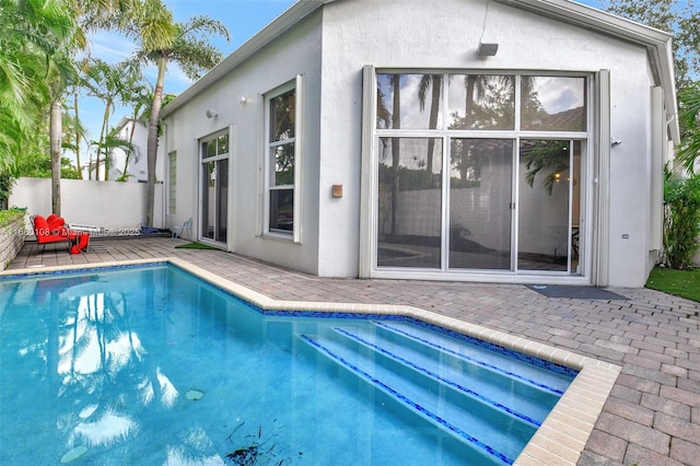 view of swimming pool featuring a patio