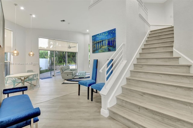 stairway with a towering ceiling