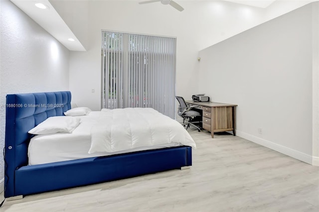 bedroom featuring ceiling fan and hardwood / wood-style flooring