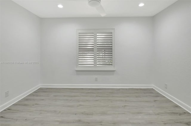 spare room with light hardwood / wood-style floors