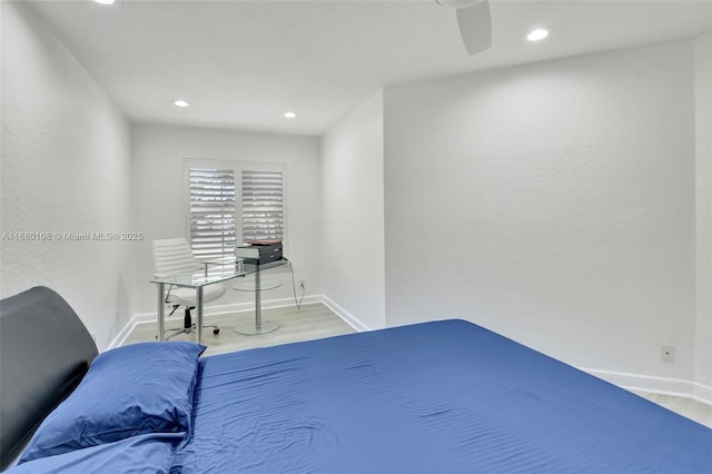 bedroom featuring light hardwood / wood-style floors and ceiling fan