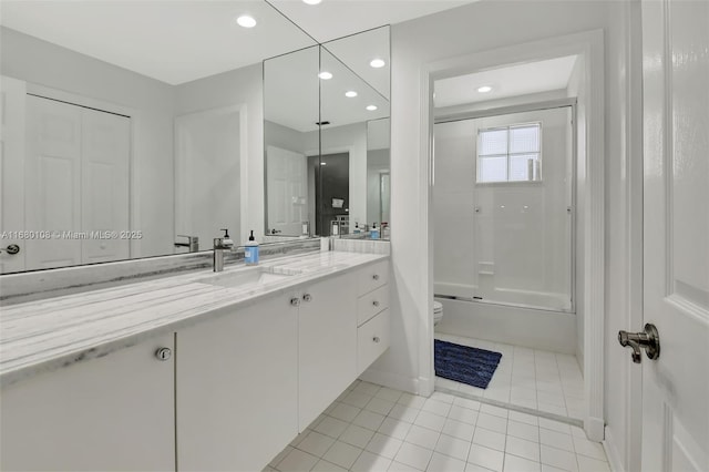 full bathroom featuring tile patterned floors, vanity, toilet, and shower / tub combination