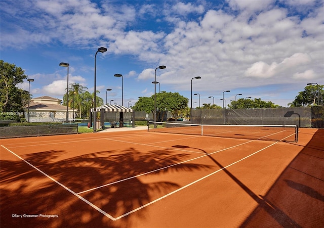 view of sport court with basketball hoop