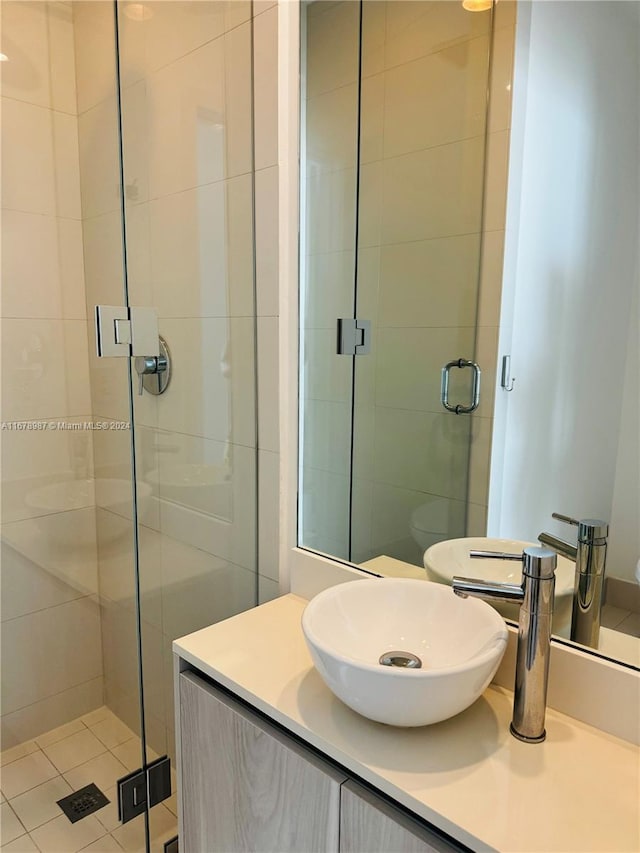 bathroom with vanity, tile patterned floors, and walk in shower