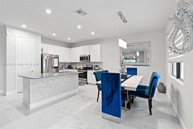 dining space featuring sink