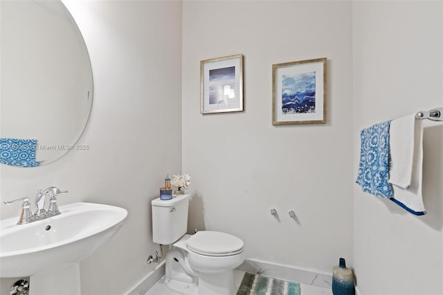 bathroom with toilet and sink