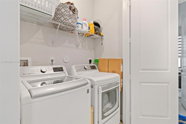 clothes washing area featuring washing machine and dryer