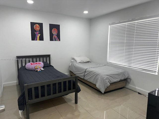 bedroom with tile patterned floors