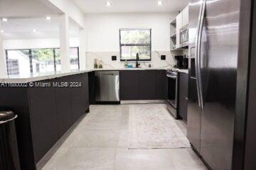 kitchen with appliances with stainless steel finishes and sink