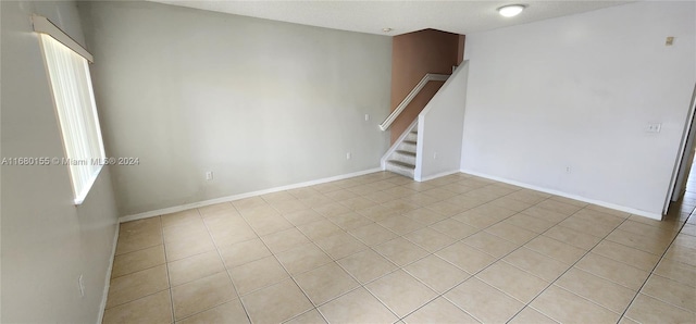 empty room featuring light tile patterned flooring