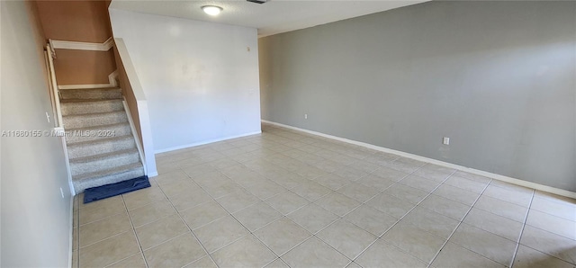 empty room with light tile patterned flooring