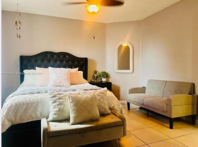 bedroom featuring ceiling fan and tile patterned flooring