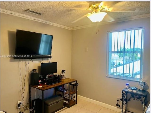 tiled office space featuring ceiling fan, a textured ceiling, and ornamental molding