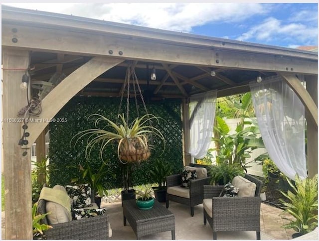 view of patio featuring a gazebo and an outdoor hangout area