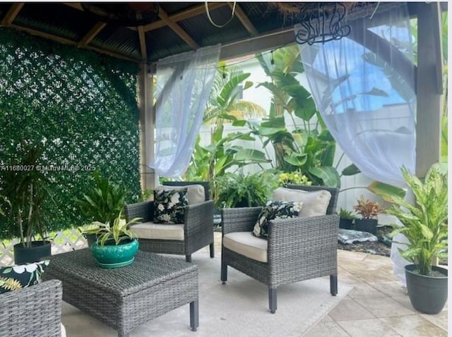 view of patio featuring a gazebo and an outdoor hangout area