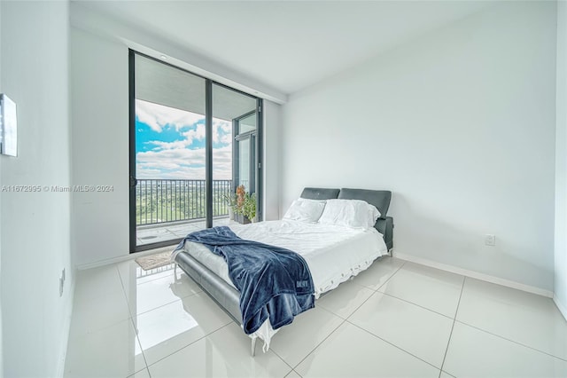 tiled bedroom with access to outside