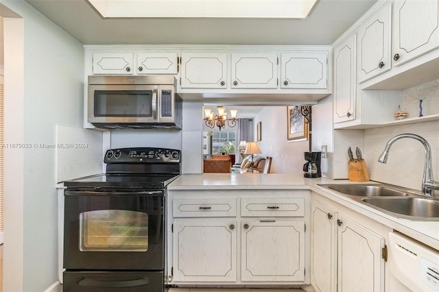 kitchen featuring white dishwasher, sink, an inviting chandelier, black range with electric stovetop, and white cabinets