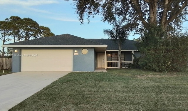 single story home featuring a garage and a front lawn