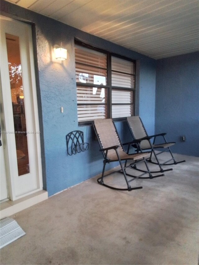 doorway to property with a porch