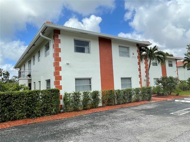 view of home's exterior featuring a balcony