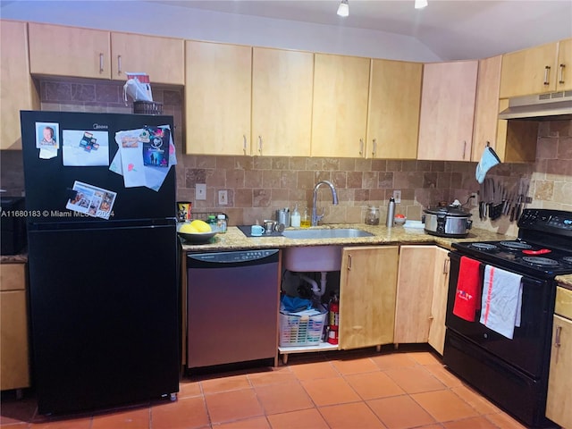 kitchen with light brown cabinets, exhaust hood, backsplash, black appliances, and sink