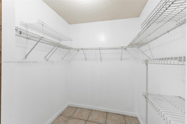 walk in closet featuring light tile patterned floors