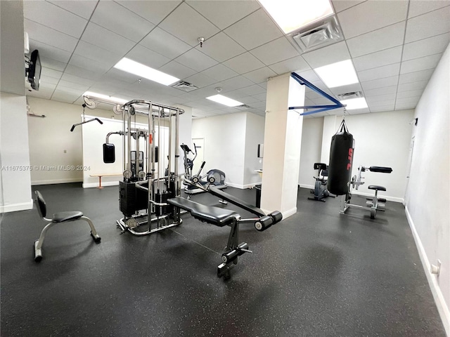 workout area with a paneled ceiling