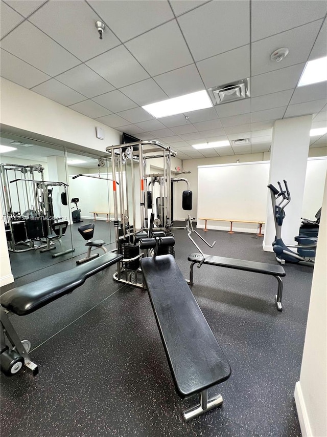 workout area featuring a drop ceiling