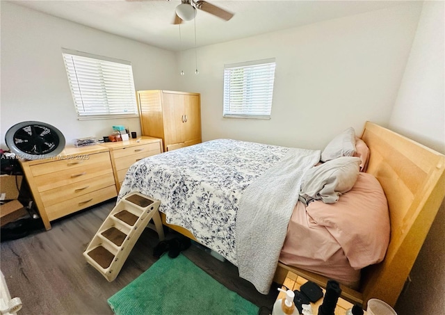 bedroom featuring dark wood-type flooring and a ceiling fan