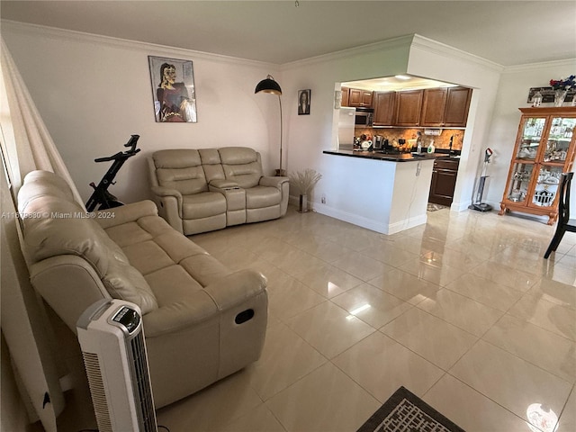 living room featuring crown molding and light tile patterned floors