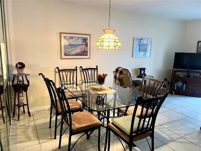 dining area featuring light tile patterned flooring