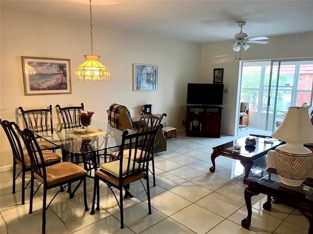 dining area featuring light tile patterned floors and ceiling fan