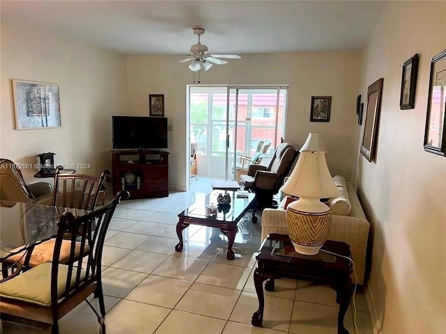 tiled living room featuring ceiling fan