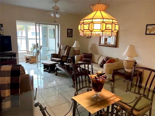 living room with ceiling fan and light tile patterned floors