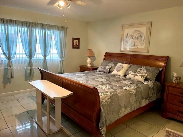 bedroom with ceiling fan and light tile patterned floors