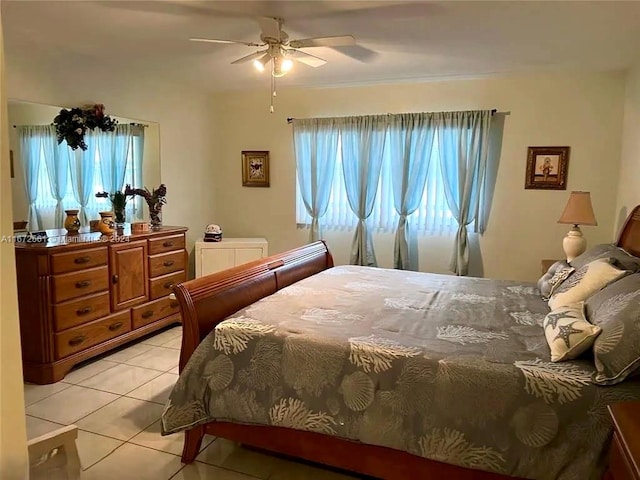 bedroom with light tile patterned flooring and ceiling fan