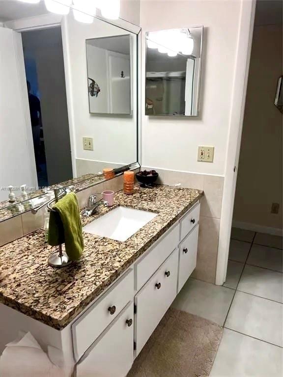 bathroom featuring vanity and tile patterned flooring