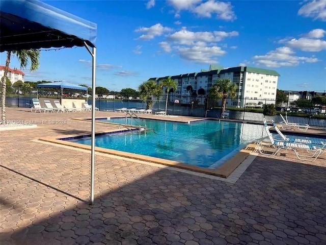 view of swimming pool with a patio area