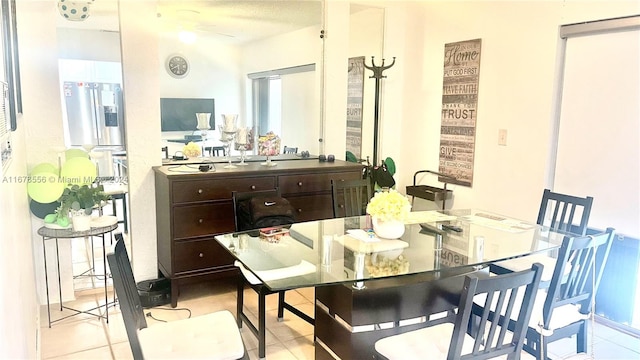 dining space featuring light tile patterned floors