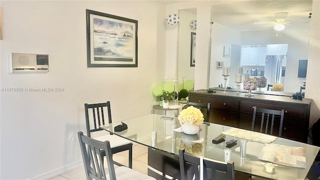 tiled dining area featuring ceiling fan