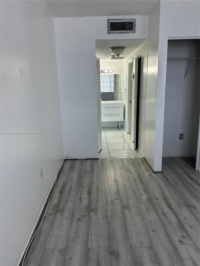 corridor featuring light hardwood / wood-style flooring