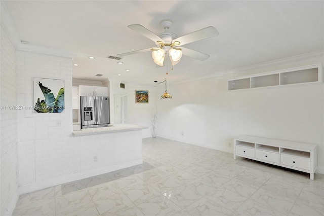 unfurnished living room with ornamental molding and ceiling fan