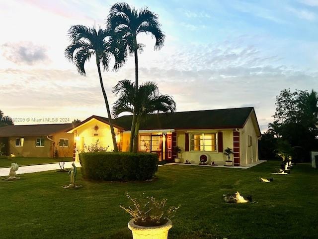 view of front of house with a lawn