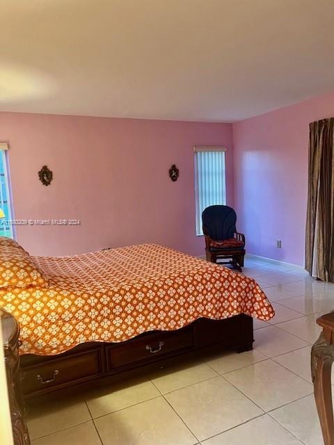 bedroom featuring light tile patterned flooring