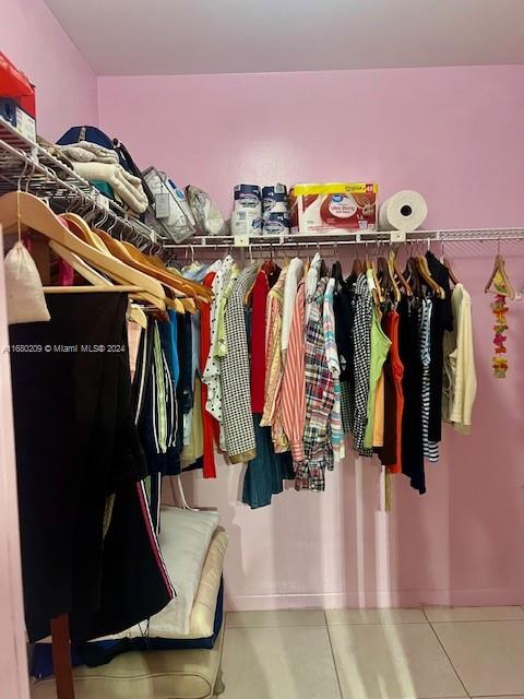 spacious closet featuring tile patterned floors